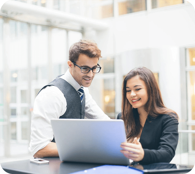 Business colleagues working on laptop.