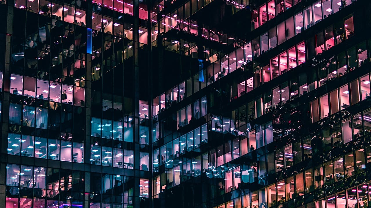 Night view of illuminated office building.