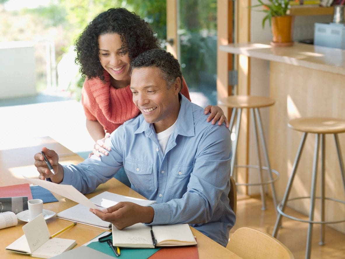 Couple reviewing documents together.