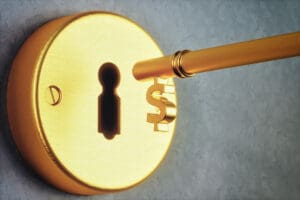 Dollar Shaped Key And Keyhole Gold key unlocks dollar sign in lock.