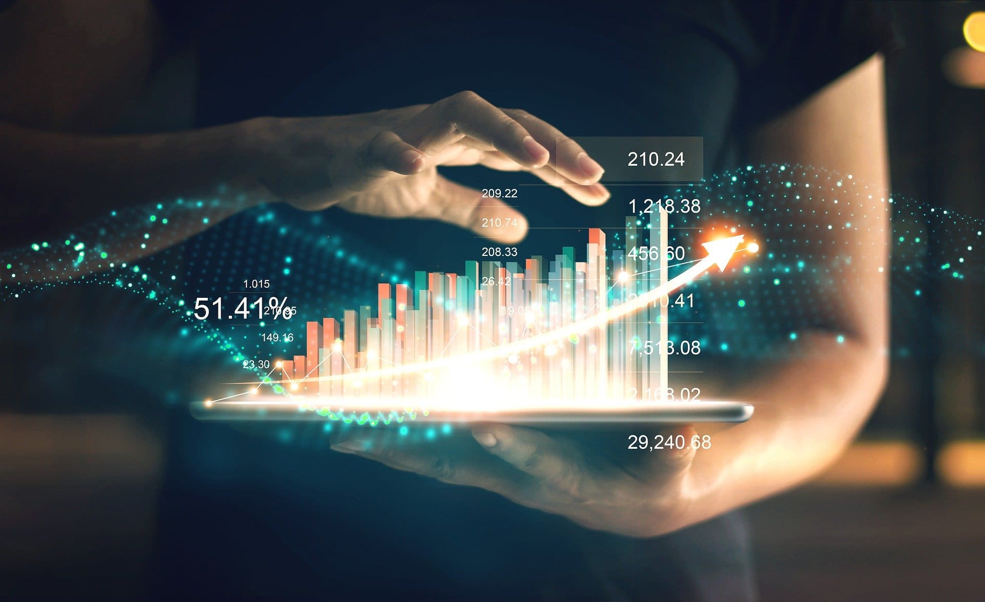 Person viewing upward trending financial graph.